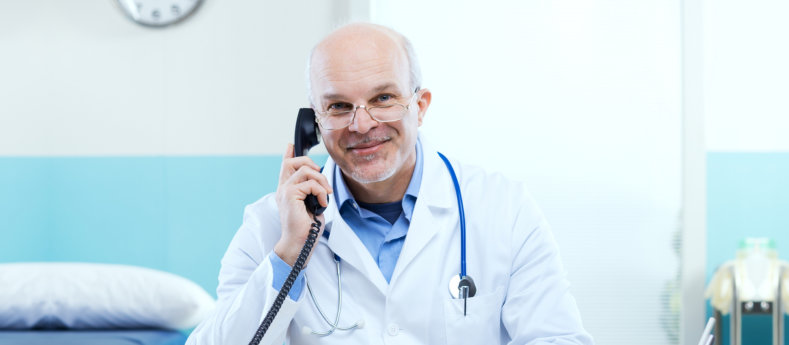 doctor holding a phone